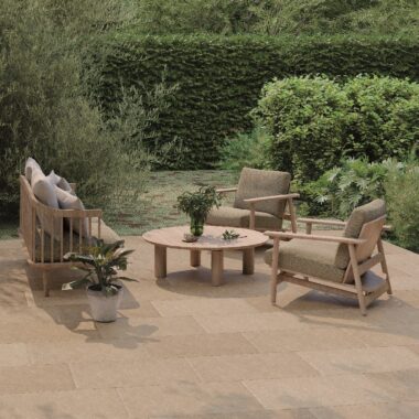 Juliette Sand Stone Effect Tiles in an outdoor setting with chic patio furniture